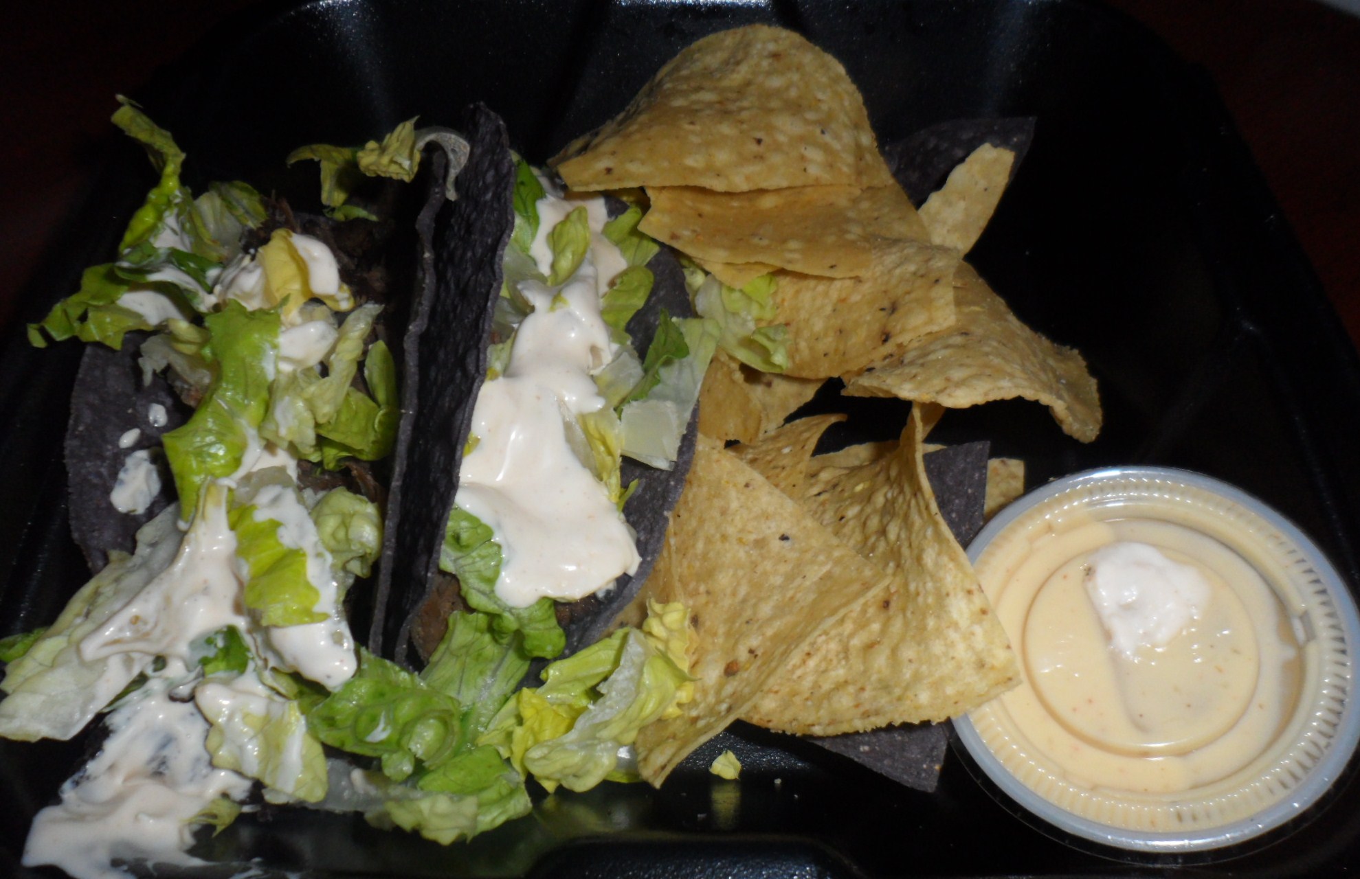 Baja Taco meal with cihps and queso