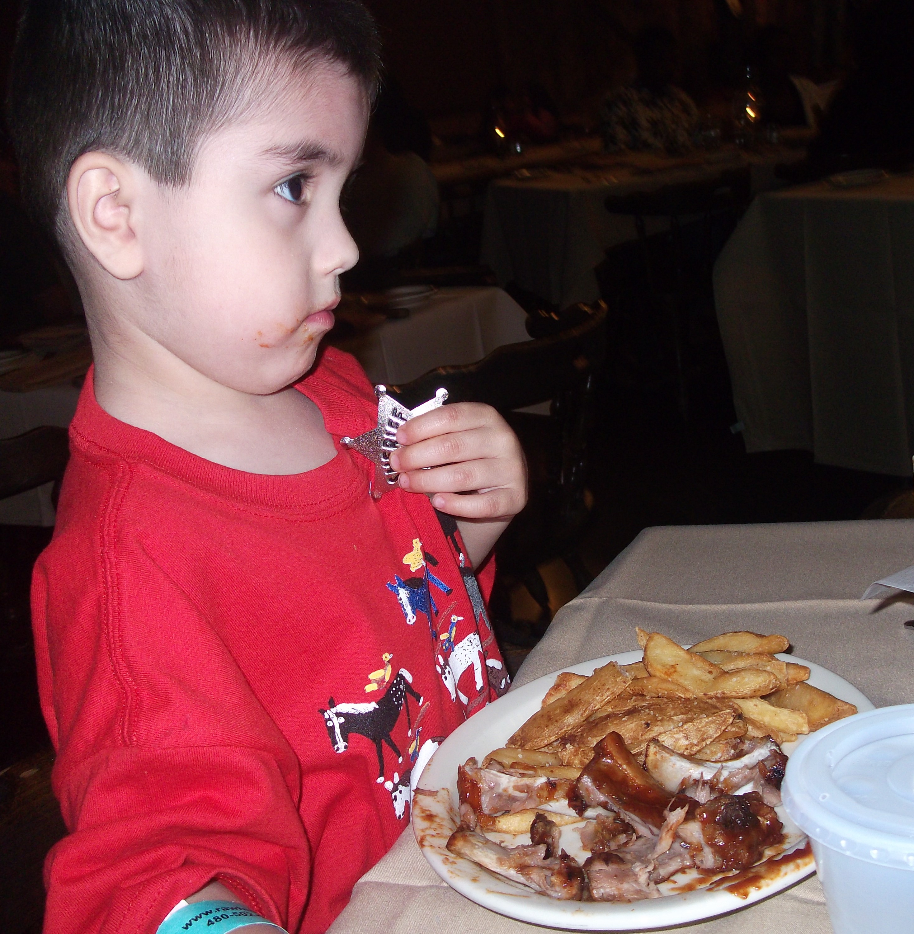 Connor had one of his favorite foods- ribs. He also got a sheriff's badge. I don't remember what I ate; I'm sure it was steak. I do remember that it was good though.