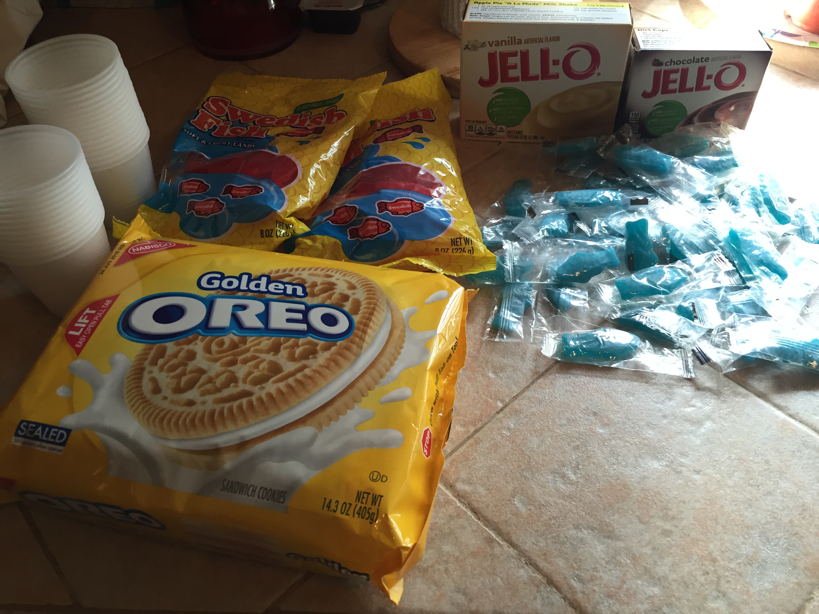 Here are the ingredients we used: Vanilla Pudding Chocolate Pudding Red and Blue Swedish Fish Golden Oreos We also used milk as per the directions on the pudding  as well as turquoise food coloring.